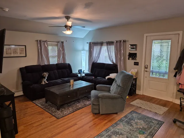 a living room with furniture and a window