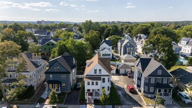 a view of multiple houses with a city street