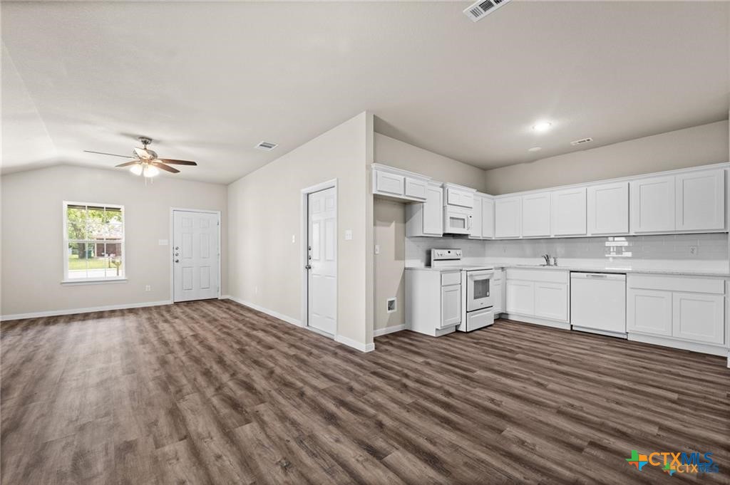 313 Elbert Lane, Unit B Harker Heights, TX 76548 - Photo 2 of 10 a view of kitchen with wooden floor and electronic appliances