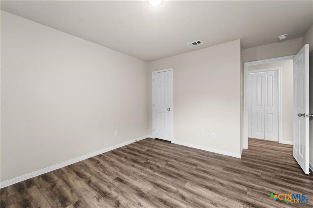 313 Elbert Lane, Unit B Harker Heights, TX 76548 - Photo 6 of 10 a view of empty room with wooden floor