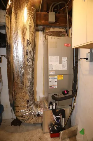 a kitchen with stainless steel appliances a stove sink microwave and window