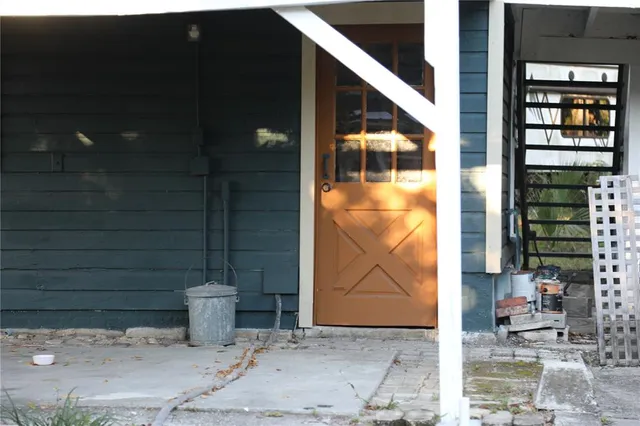 a living room with furniture and a book shelf