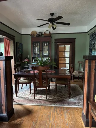 a view of staircase with wooden floor and windows
