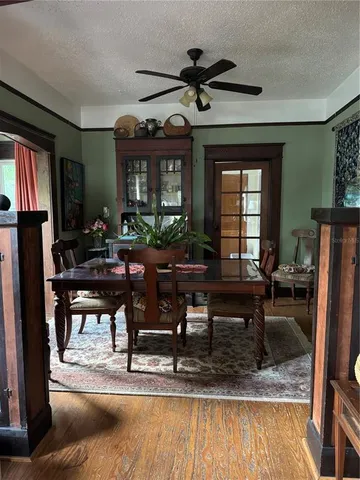 a view of staircase with wooden floor and windows