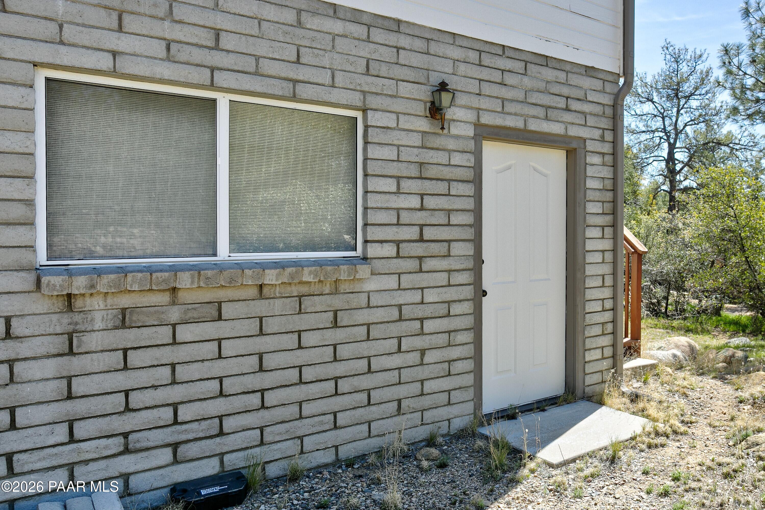 1533 Buttermilk Road Prescott, AZ 86305 - Photo 32 of 36 033_Man door off garage