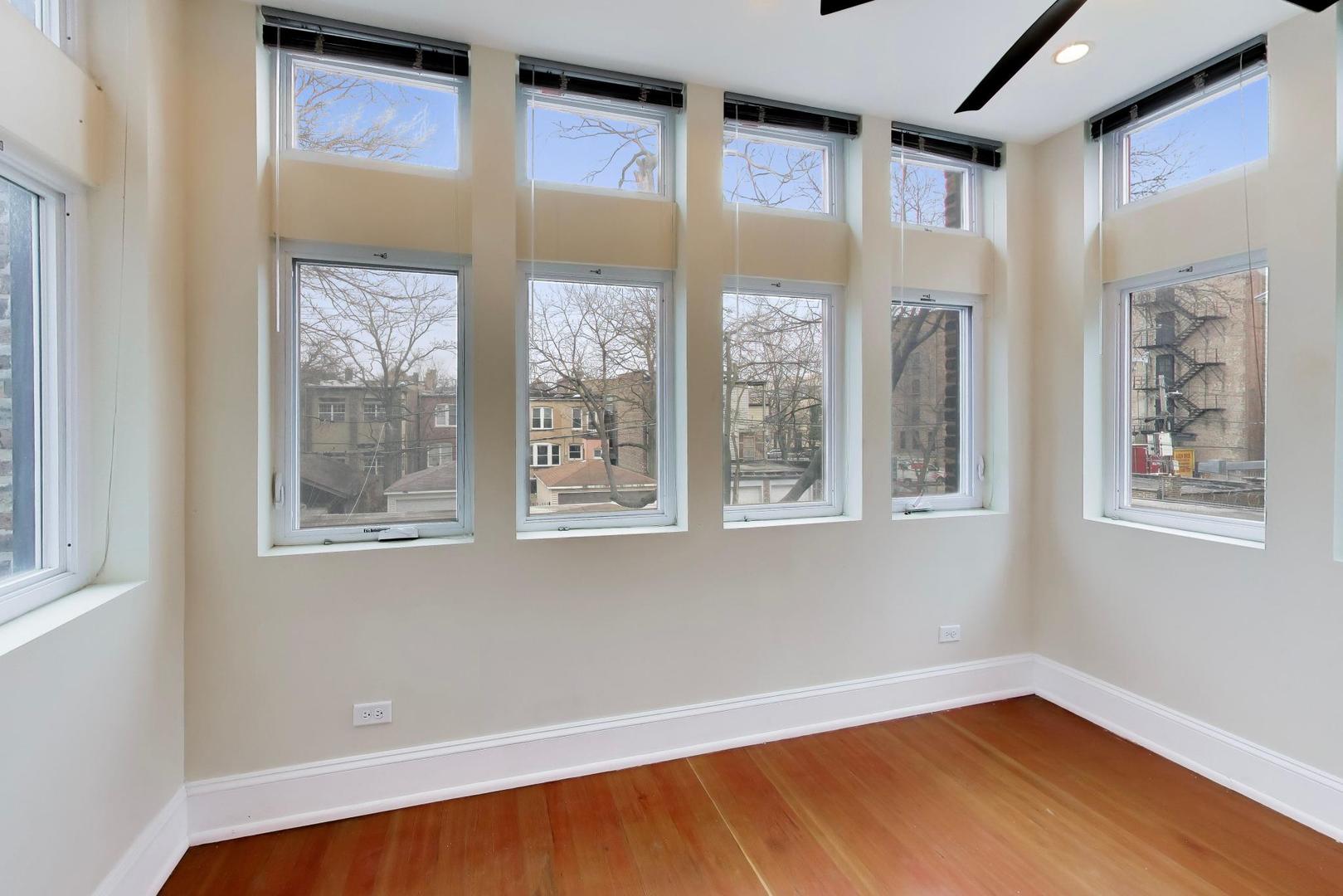 825 East Drexel Square, Unit 2 Chicago, IL 60615 - Photo 14 of 25 a view of an empty room with a window