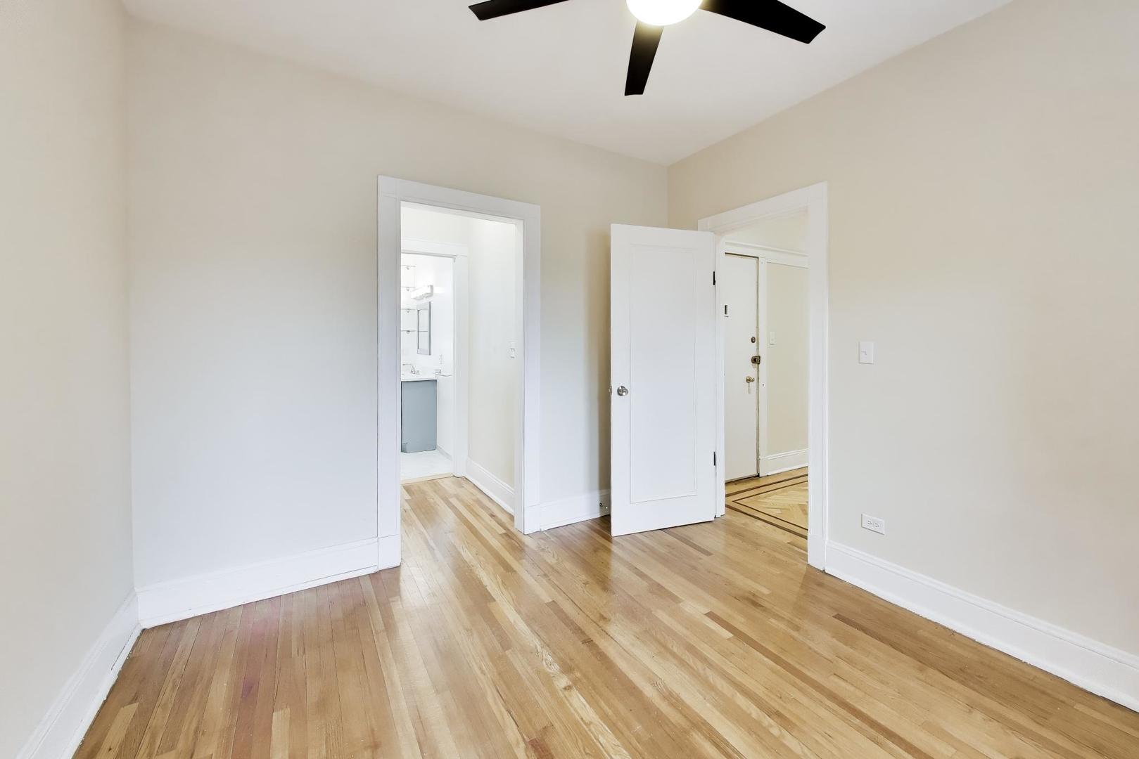 825 East Drexel Square, Unit 2 Chicago, IL 60615 - Photo 16 of 25 a view of empty room with wooden floor