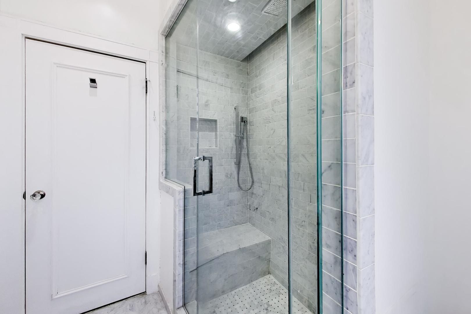 825 East Drexel Square, Unit 2 Chicago, IL 60615 - Photo 18 of 25 a bathroom with a shower and a sink