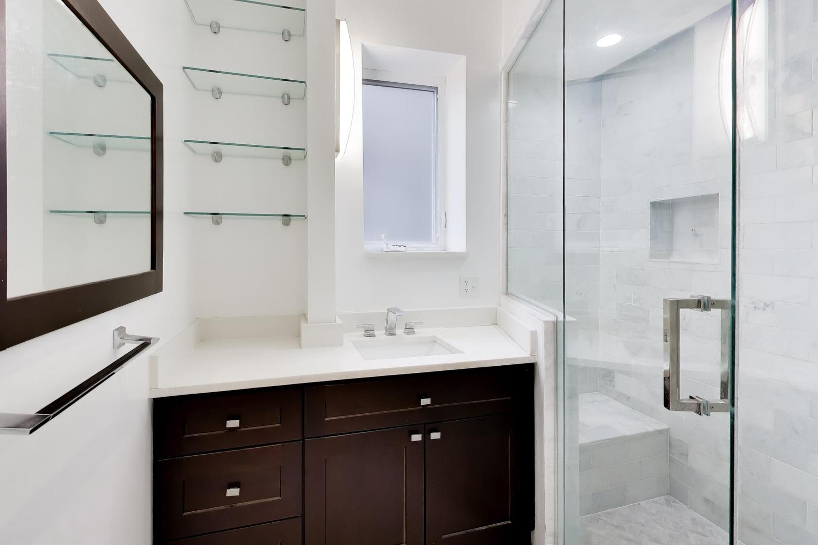 825 East Drexel Square, Unit 2 Chicago, IL 60615 - Photo 24 of 25 a bathroom with a sink and a mirror