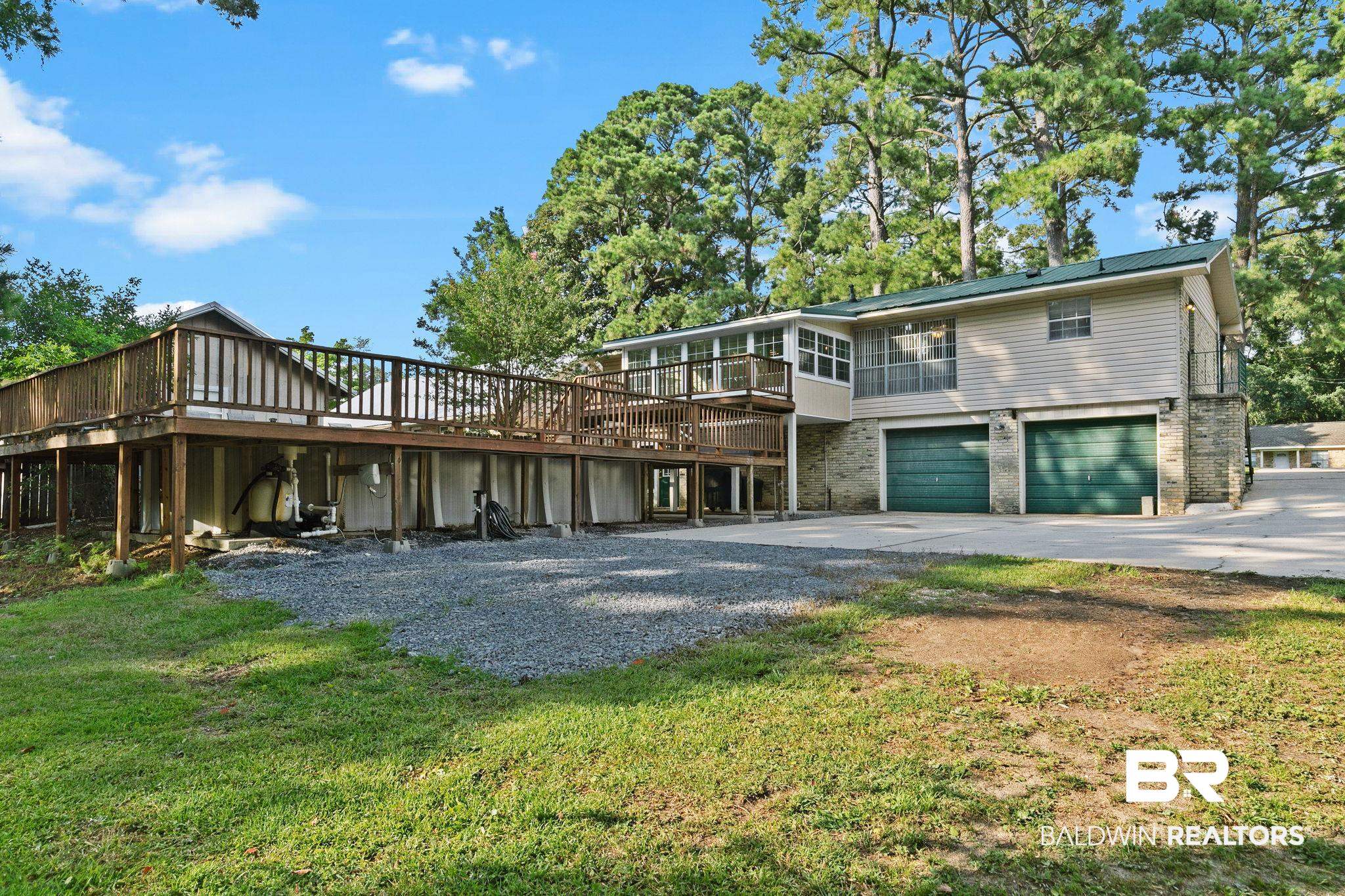 14 Lee Circle Daphne, AL 36527 - Photo 13 of 83 Rear view of property with a wooden deck, a garage, and a yard