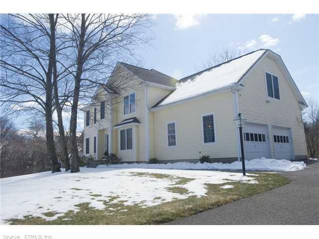 5 Strawberry Fields Road Granby, CT 06035 - Photo 1 of 1 a view of a house with snow on the side of the road