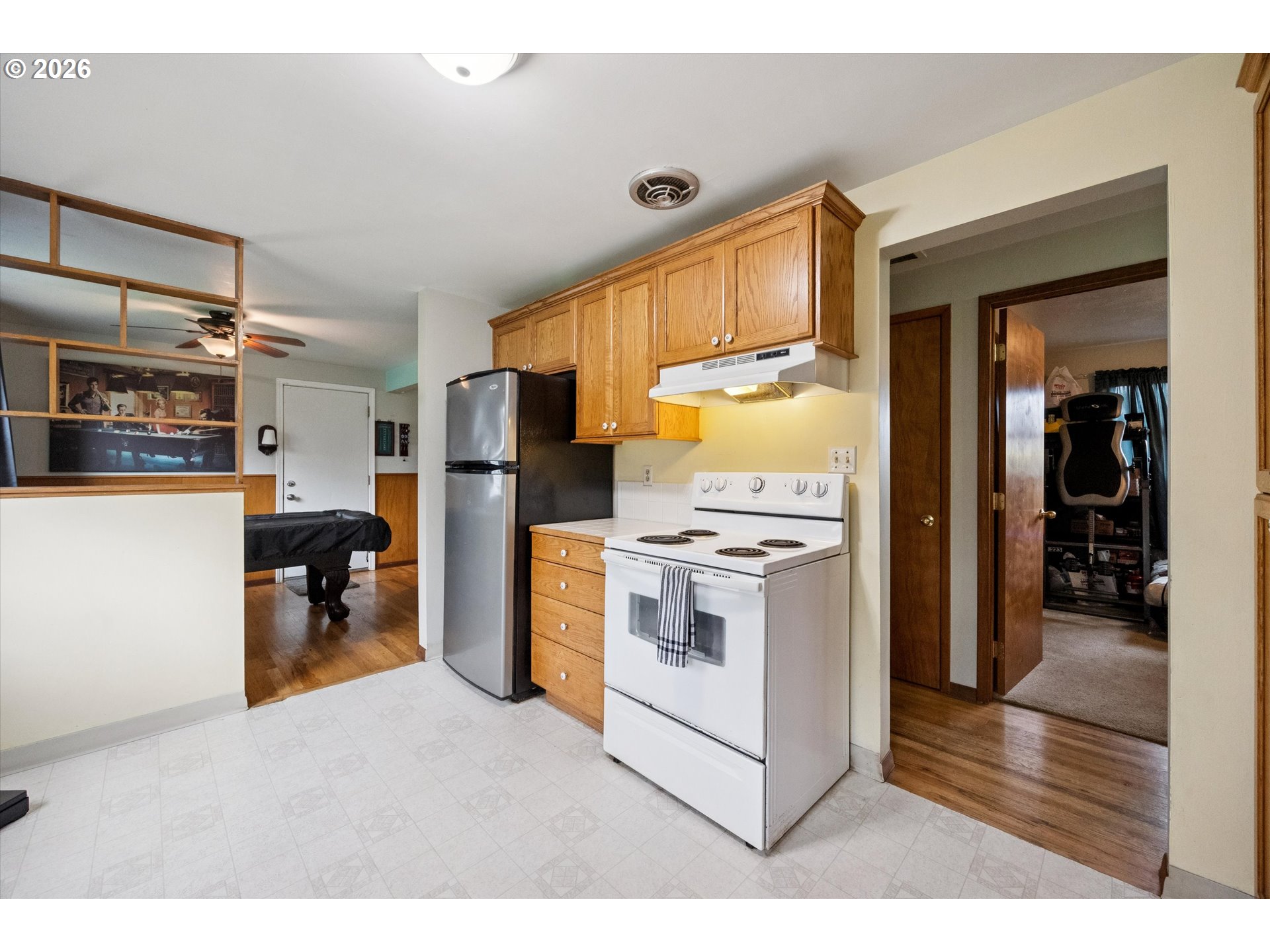 2202 Southeast 178th Place Portland, OR 97233 - Photo 11 of 30 a kitchen that has a lot of cabinets and refrigerator