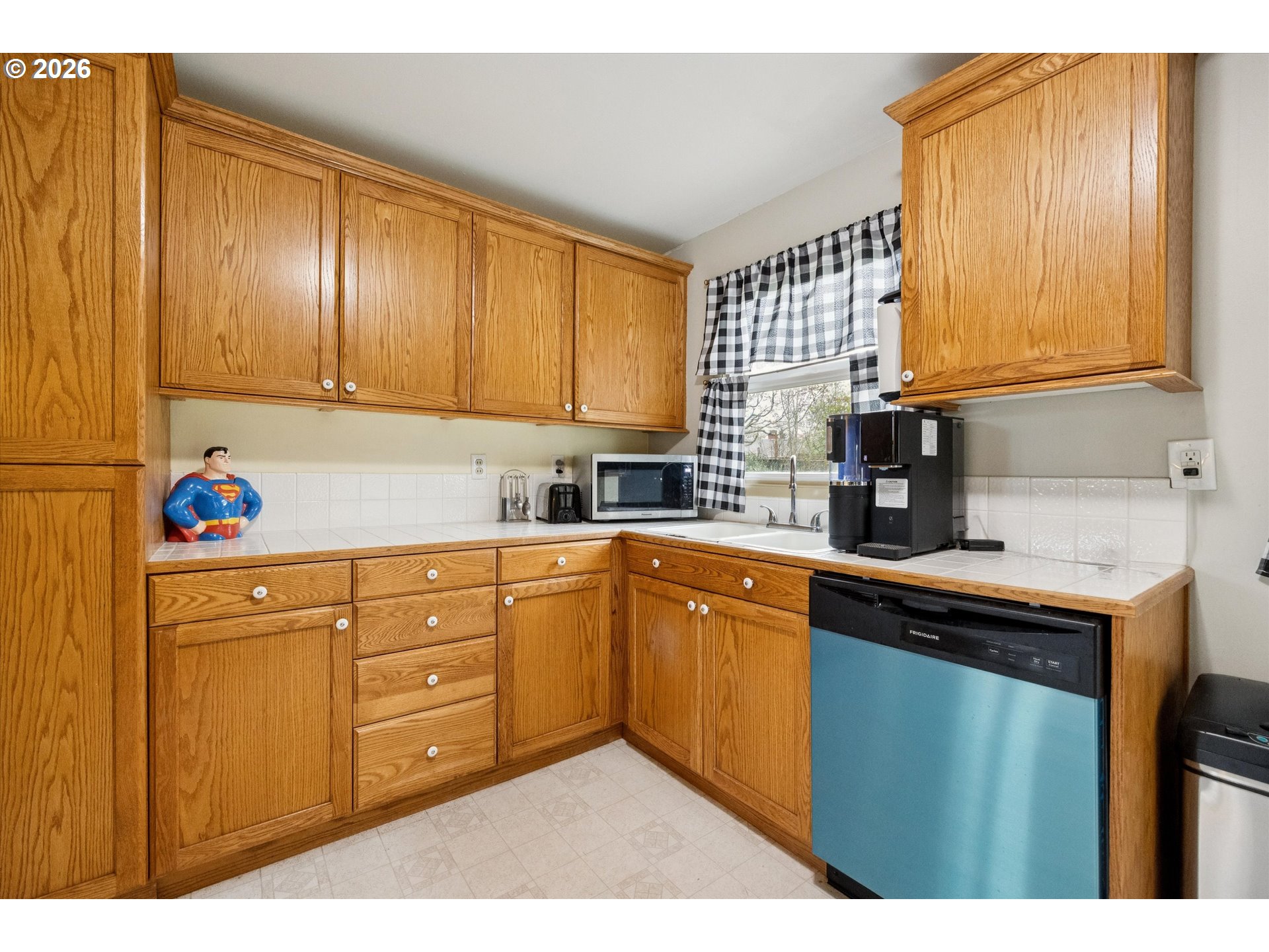 2202 Southeast 178th Place Portland, OR 97233 - Photo 12 of 30 a kitchen with cabinets a sink and appliances