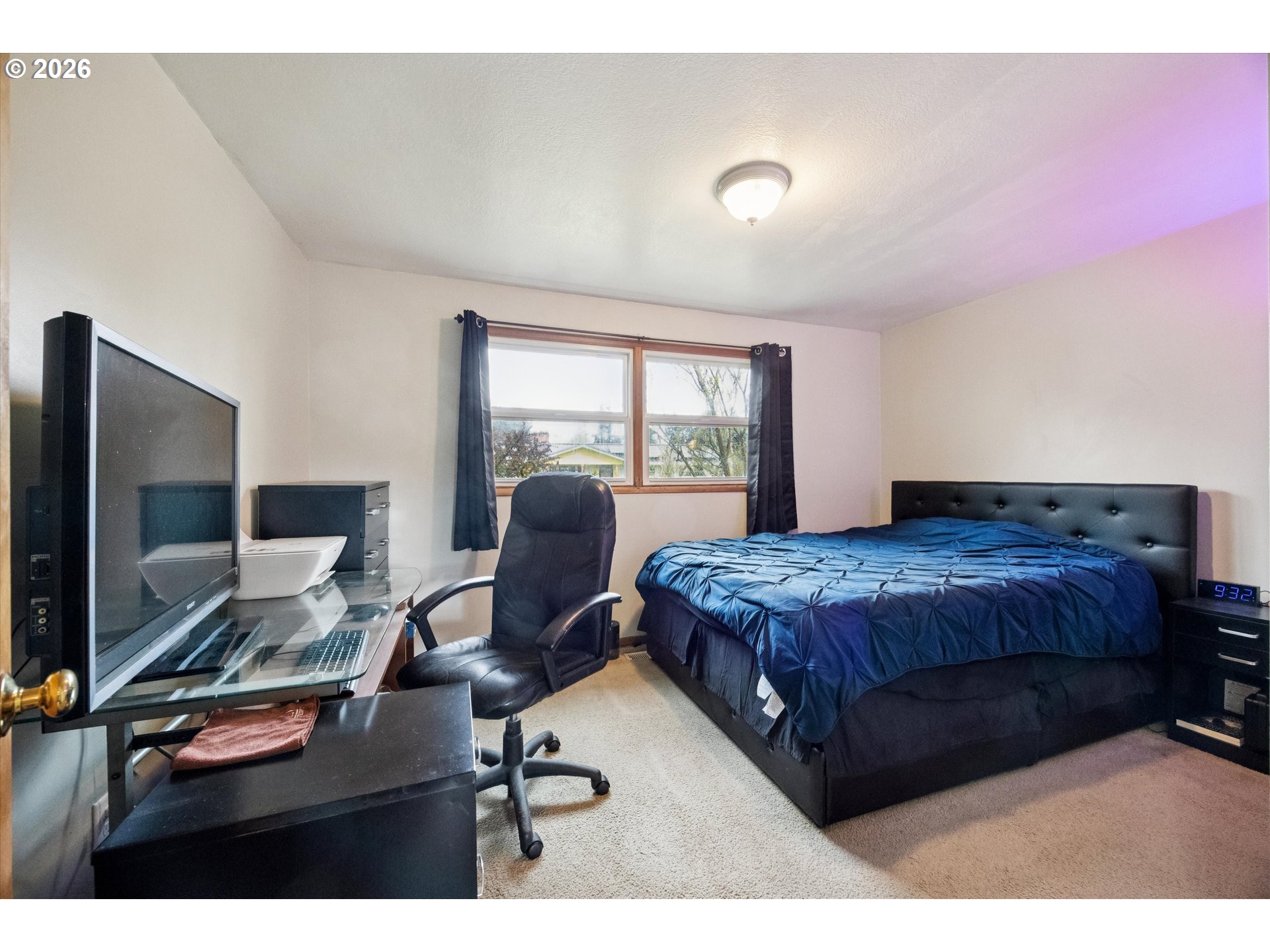 2202 Southeast 178th Place Portland, OR 97233 - Photo 15 of 30 a bedroom with a bed window and desk