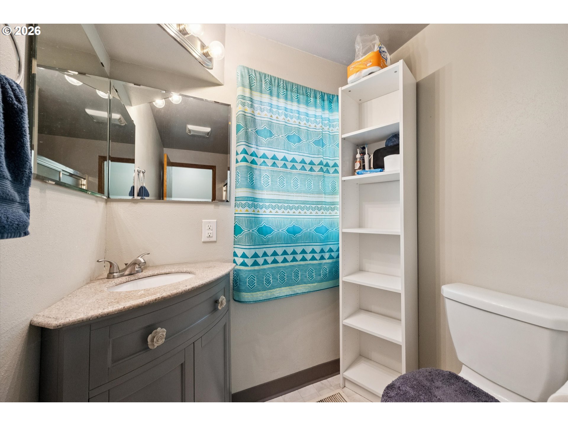 2202 Southeast 178th Place Portland, OR 97233 - Photo 18 of 30 a bathroom with a sink a toilet and shower