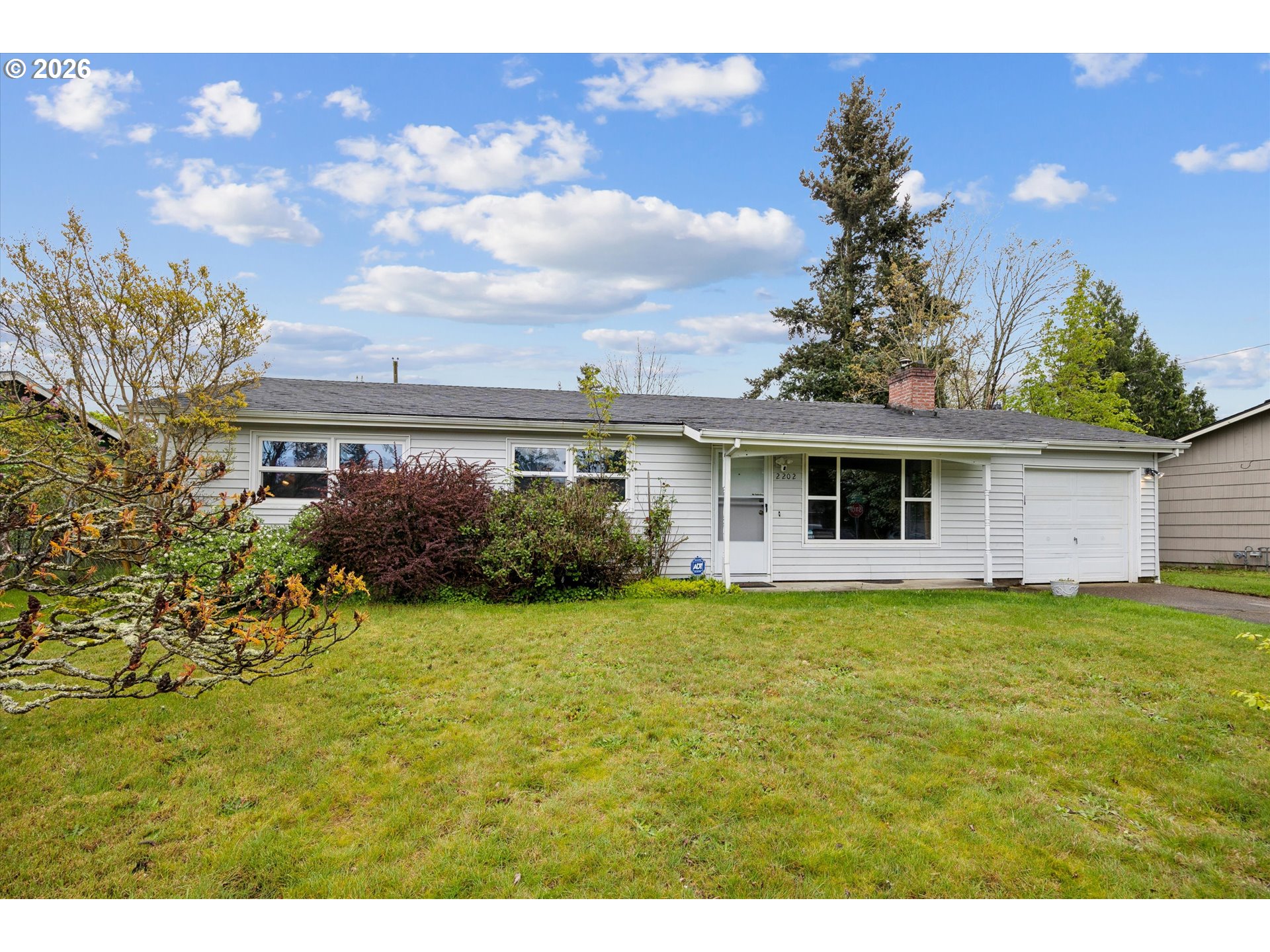 2202 Southeast 178th Place Portland, OR 97233 - Photo 2 of 30 a front view of a house with garden