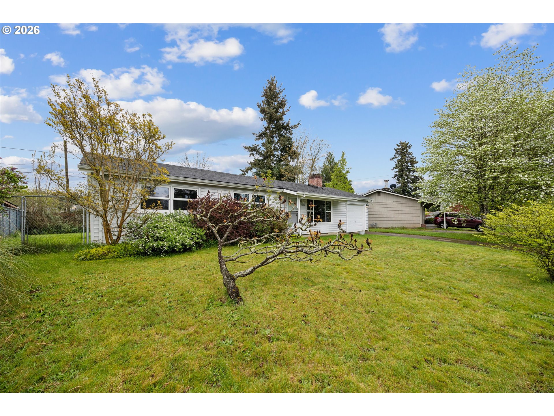 2202 Southeast 178th Place Portland, OR 97233 - Photo 3 of 30 a view of a house with a backyard