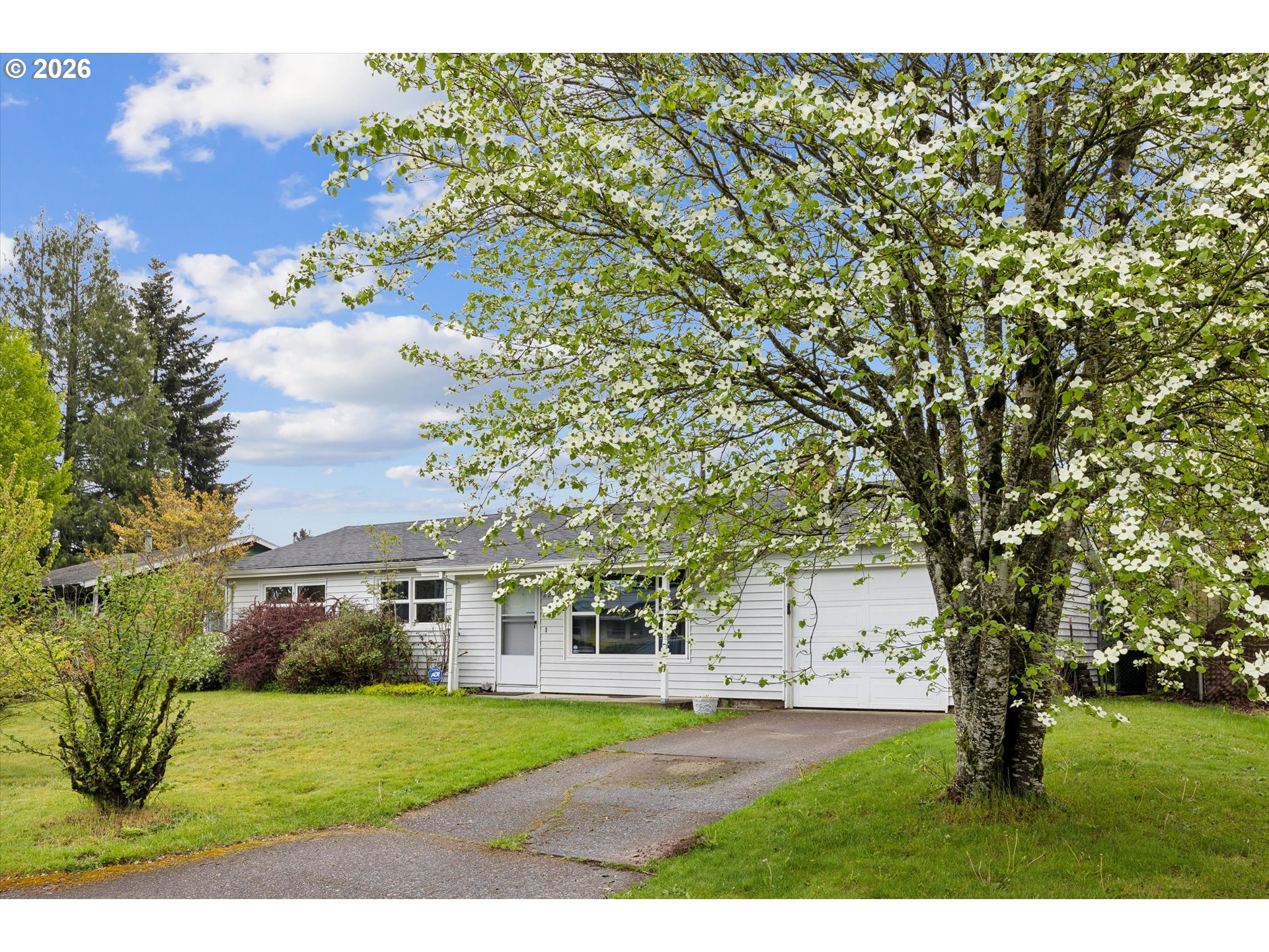 2202 Southeast 178th Place Portland, OR 97233 - Photo 4 of 30 a front view of a house with a yard