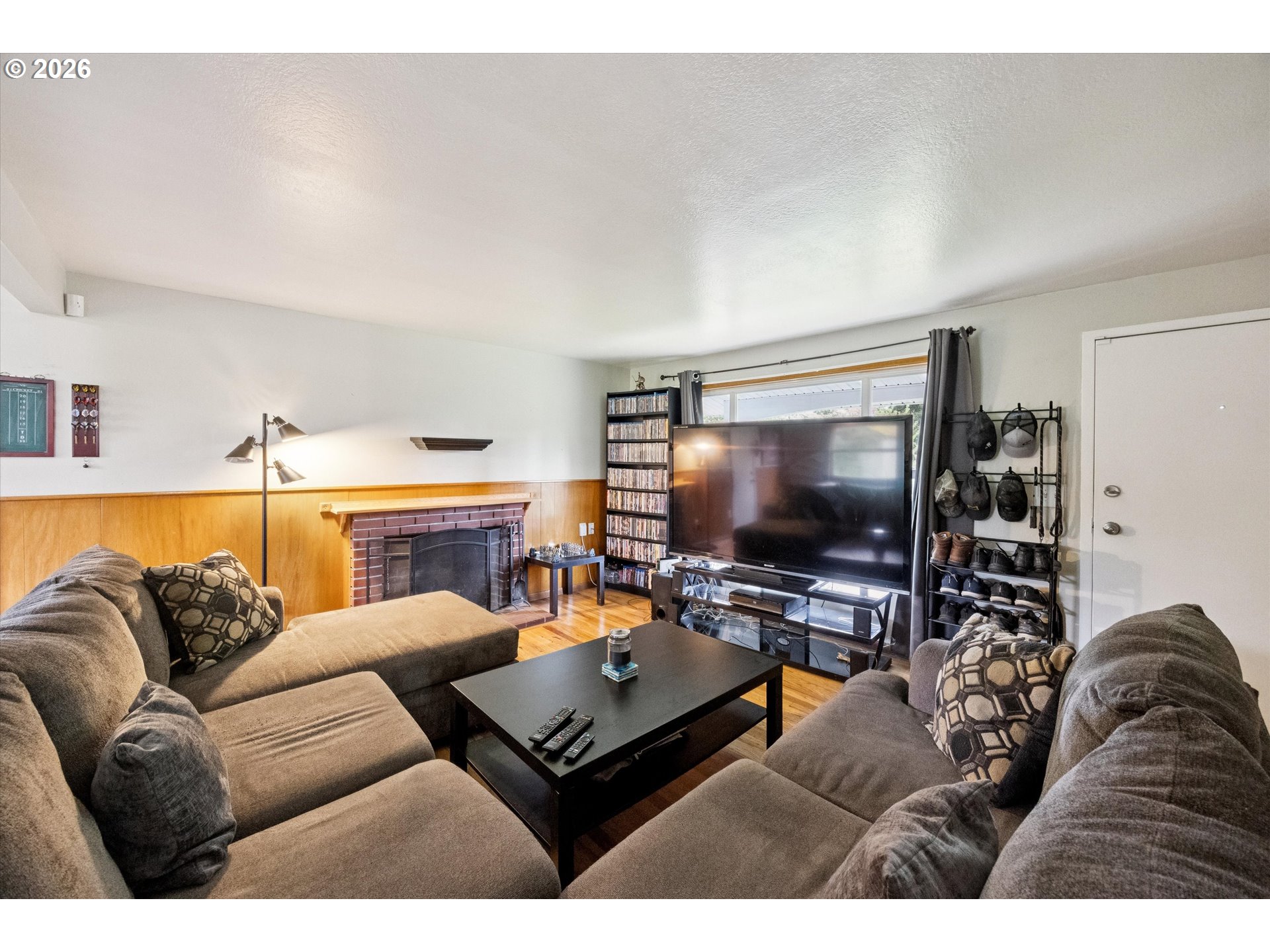2202 Southeast 178th Place Portland, OR 97233 - Photo 7 of 30 a living room with furniture and a flat screen tv