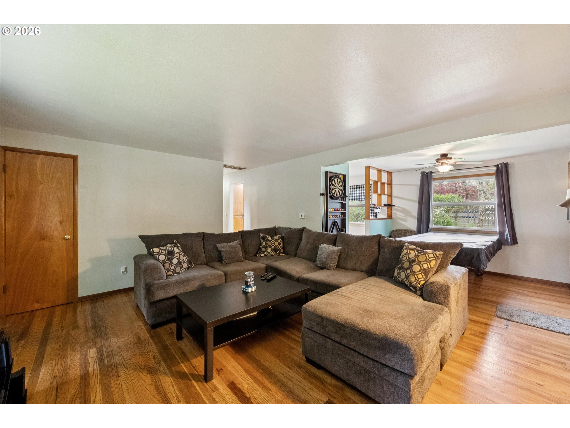 2202 Southeast 178th Place Portland, OR 97233 - Photo 8 of 30 a living room with furniture and a wooden floor