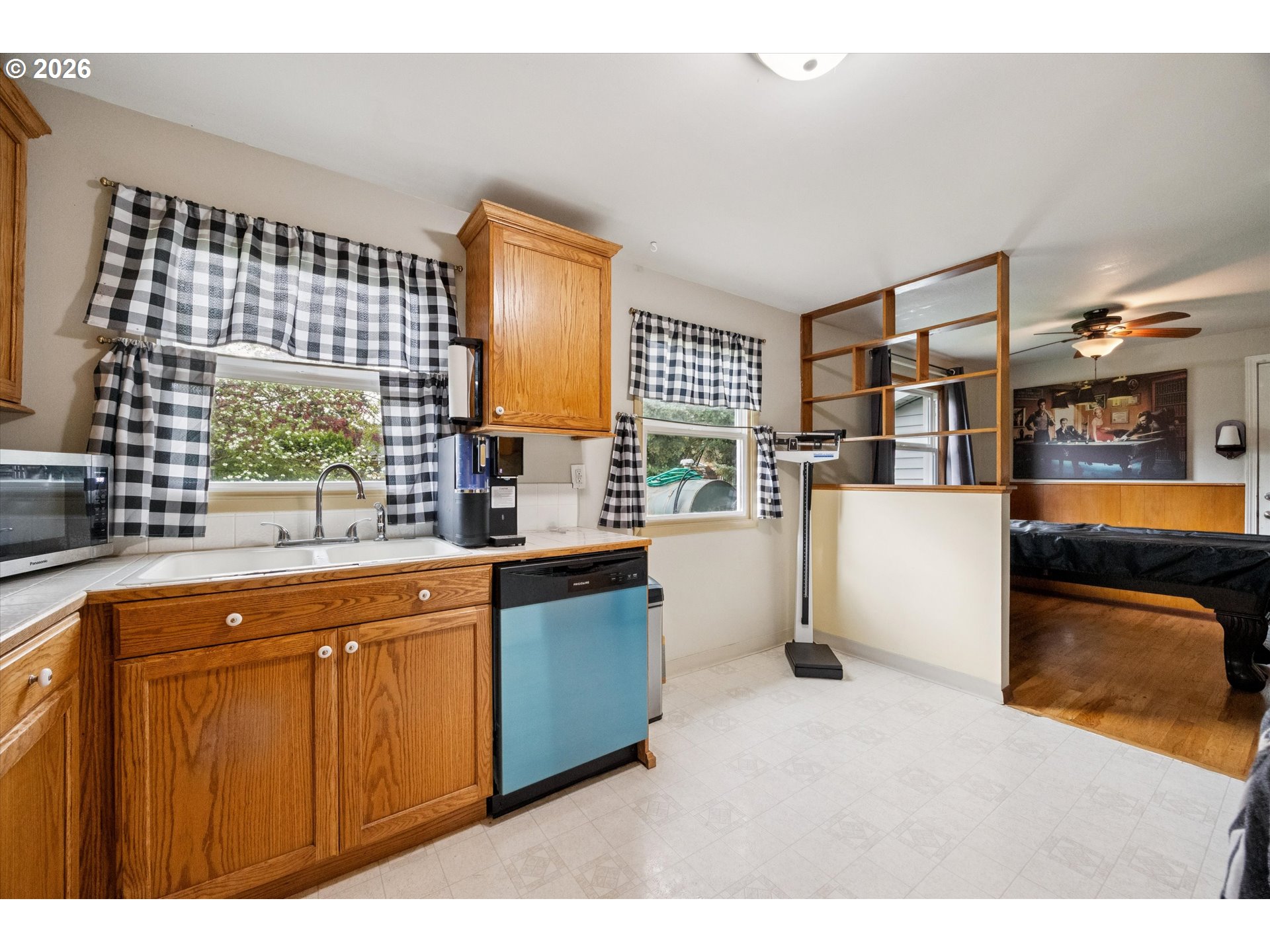 2202 Southeast 178th Place Portland, OR 97233 - Photo 10 of 30 a kitchen with a sink stove and cabinets