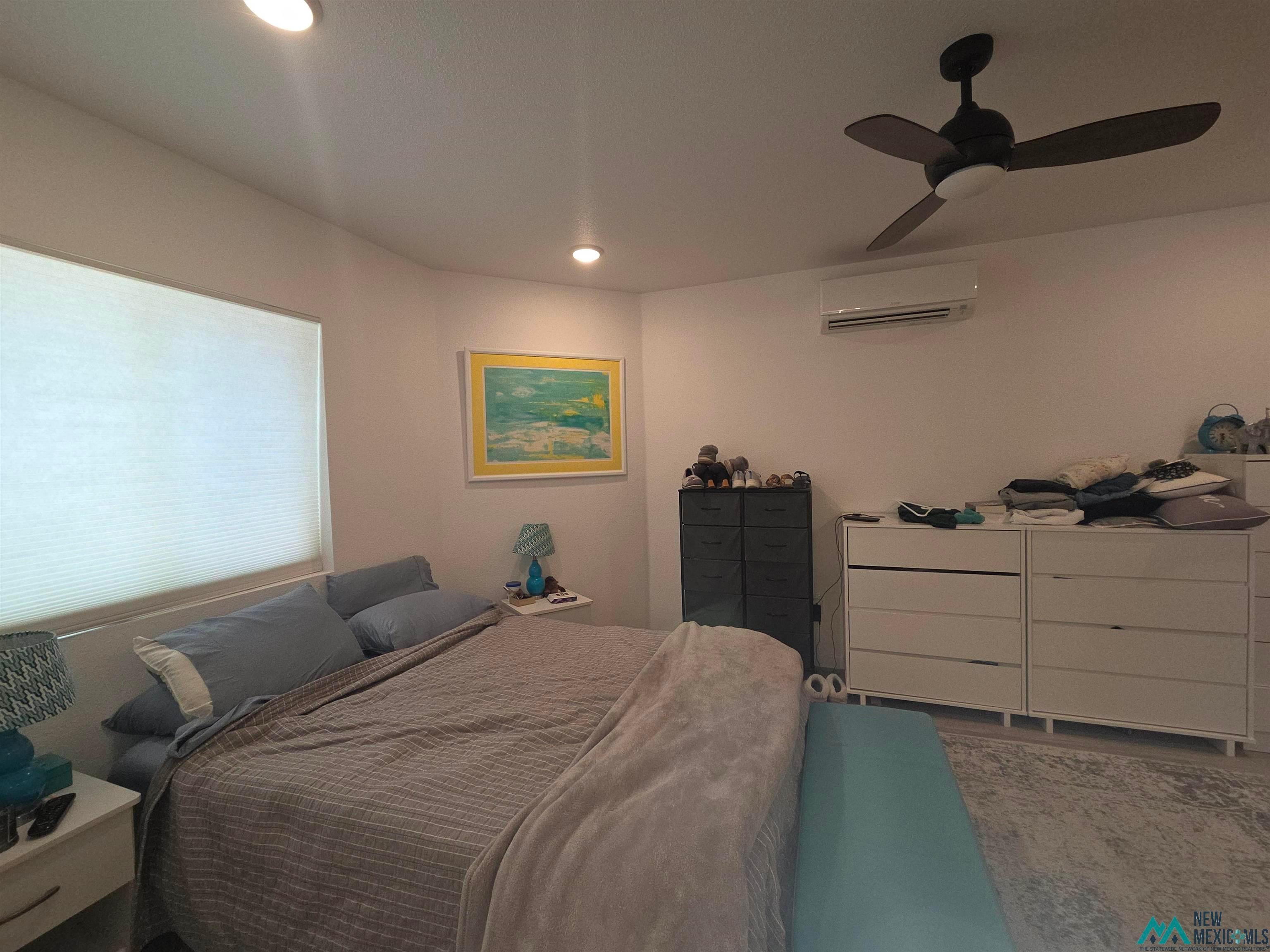 407 Bass Road Elephant Butte, NM 87935 - Photo 41 of 54 Bedroom featuring recessed lighting, ceiling fan, and a mini split for heating / cooling