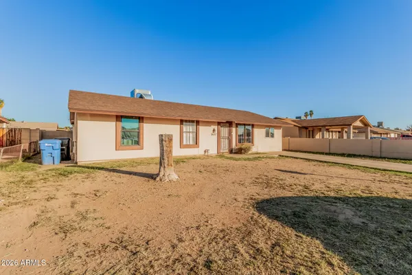 a view of a house with a snow in the yard