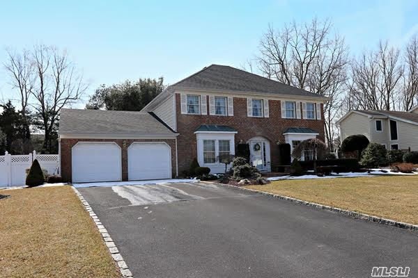 25 Timber Ridge Drive Commack, NY 11725 - Photo 1 of 1 a front view of a house with a yard