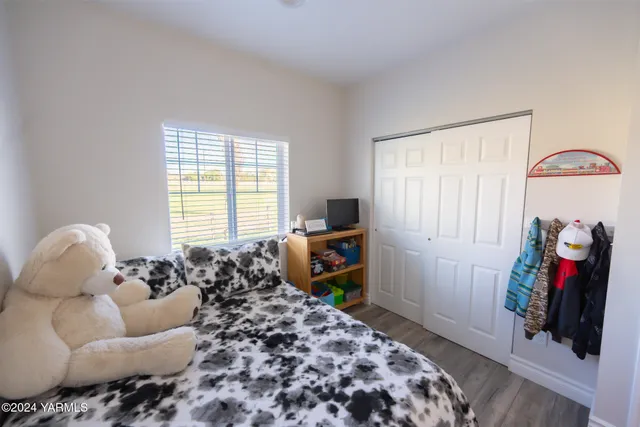 a bedroom with bed and a window