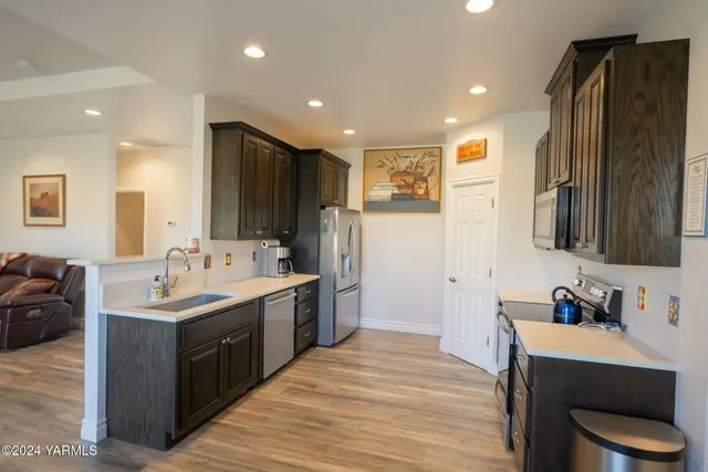 a kitchen with a sink and a refrigerator