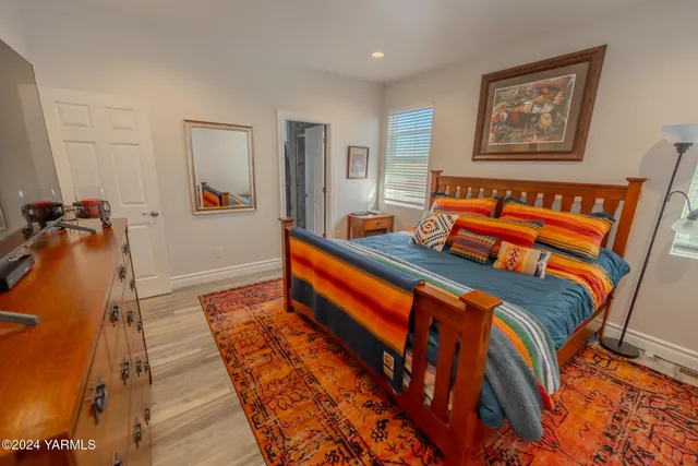 a living room with blue walls and furniture