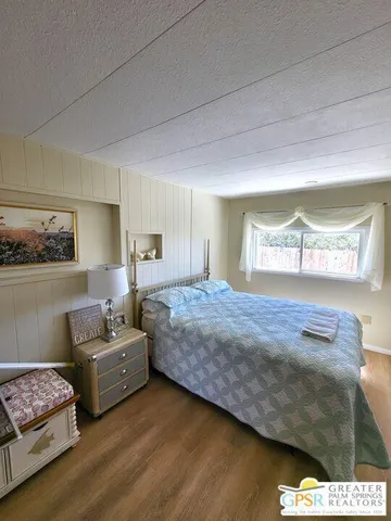 a bedroom with bed and window