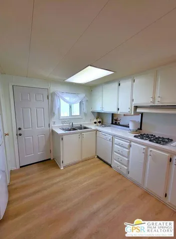 a kitchen with a white cabinets
