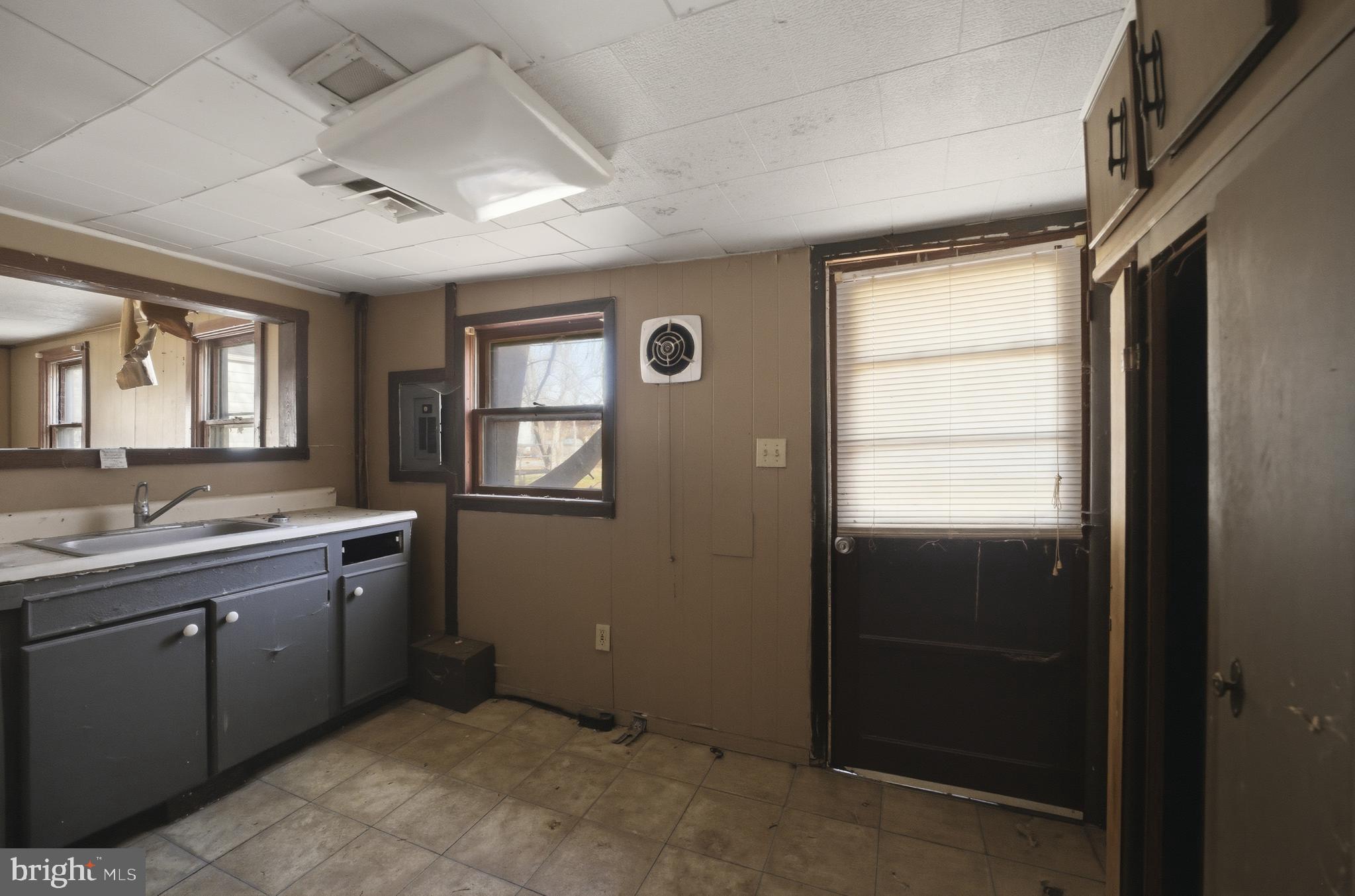24 Elm Street Salem, NJ 08079 - Photo 11 of 28 a bathroom with a sink and a mirror