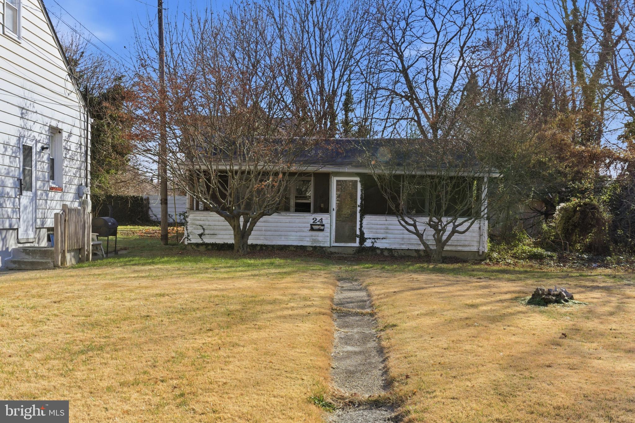 24 Elm Street Salem, NJ 08079 - Photo 3 of 28 a view of a house with large trees