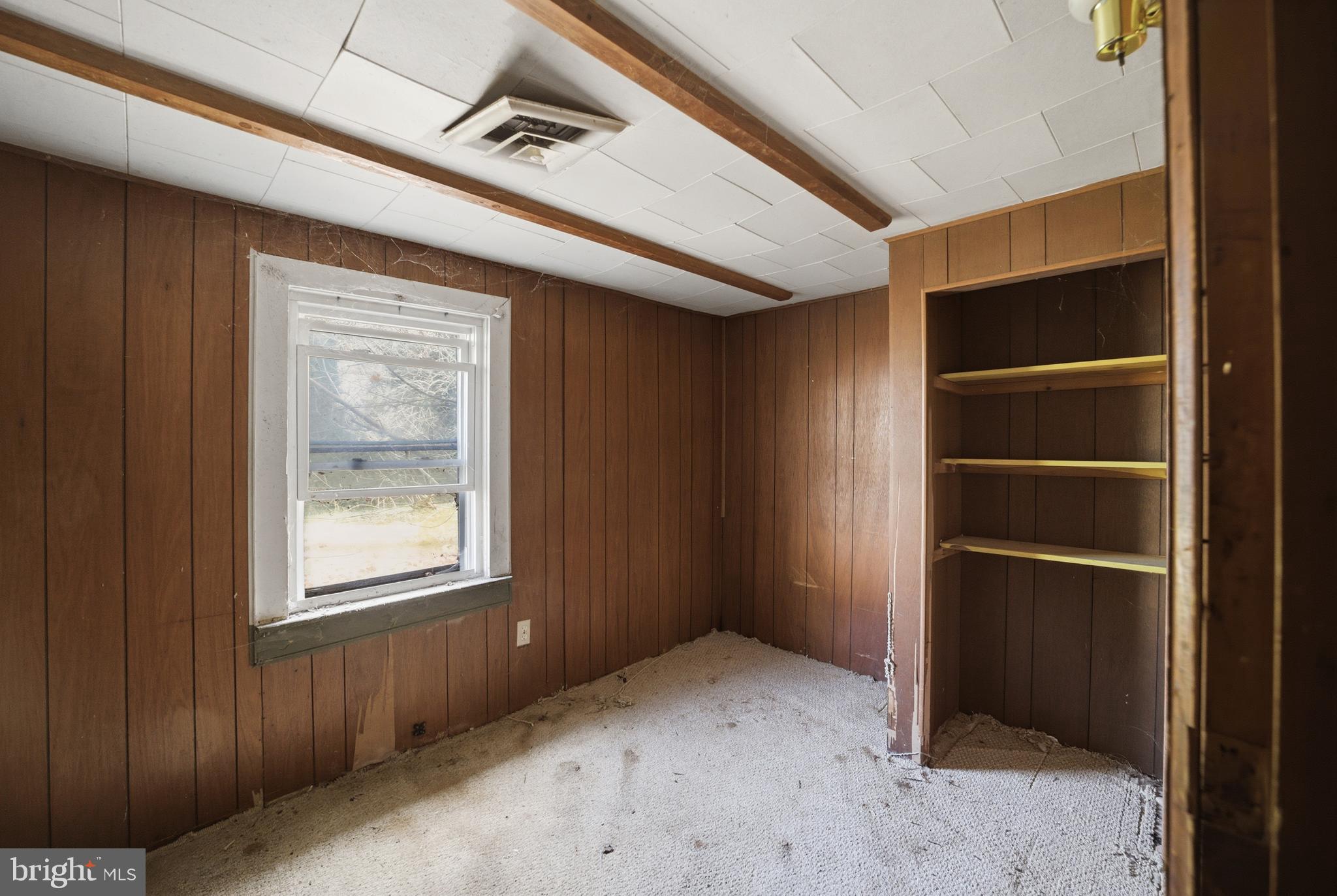 24 Elm Street Salem, NJ 08079 - Photo 9 of 28 a view of an empty room with a window