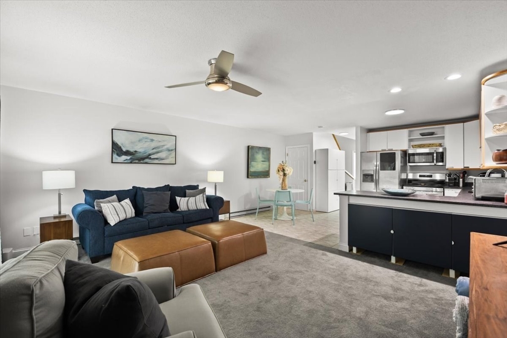 84 Round House Road, Unit 84 Bourne, MA 02532 - Photo 5 of 33 a living room with furniture and kitchen view