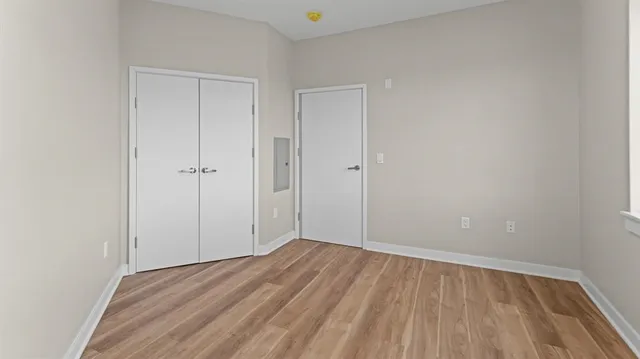 a view of room with wooden floor