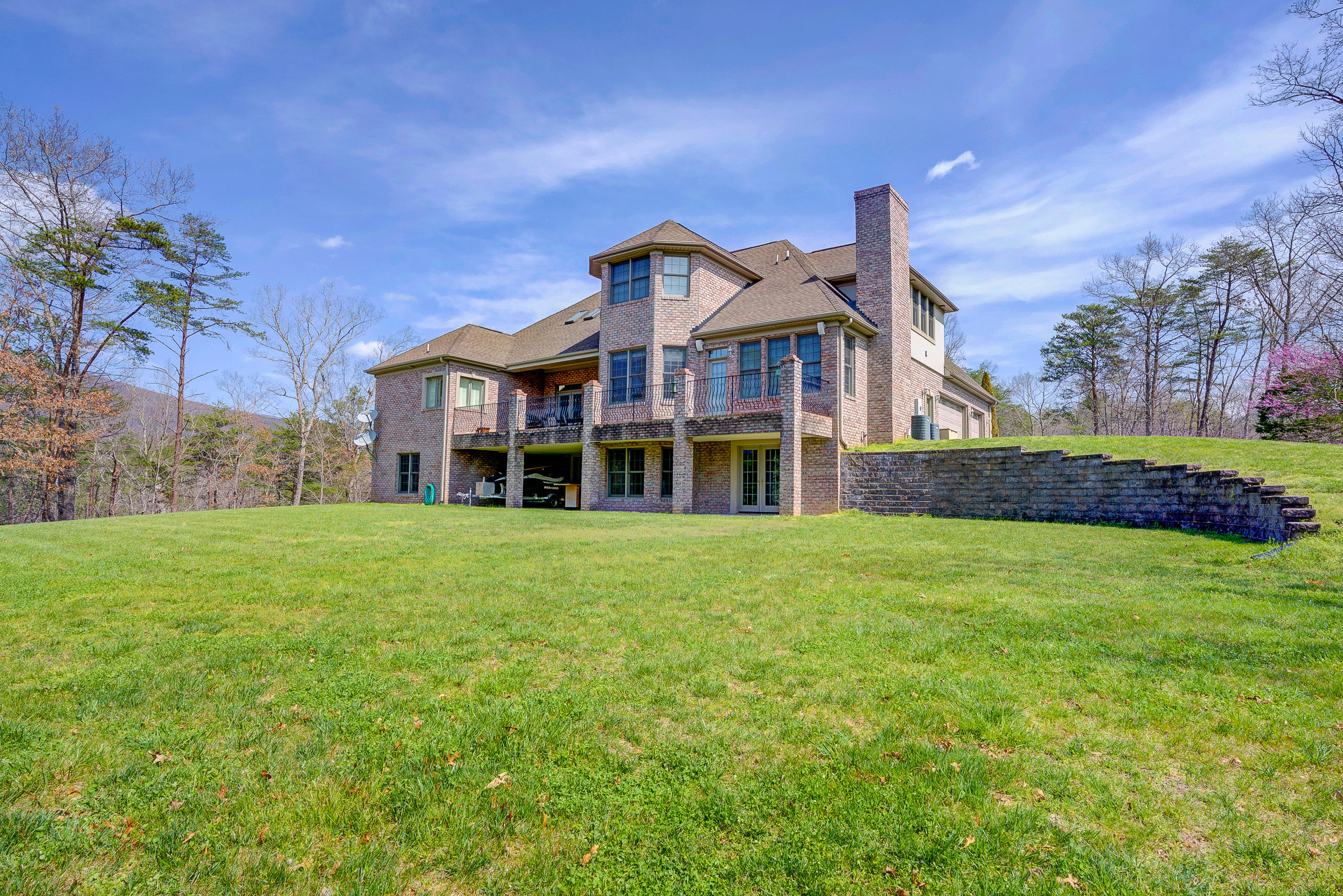 2851 New Ridge Road Elliston, VA 24087 - Photo 2 of 58 a view of a big house with a big yard and large trees
