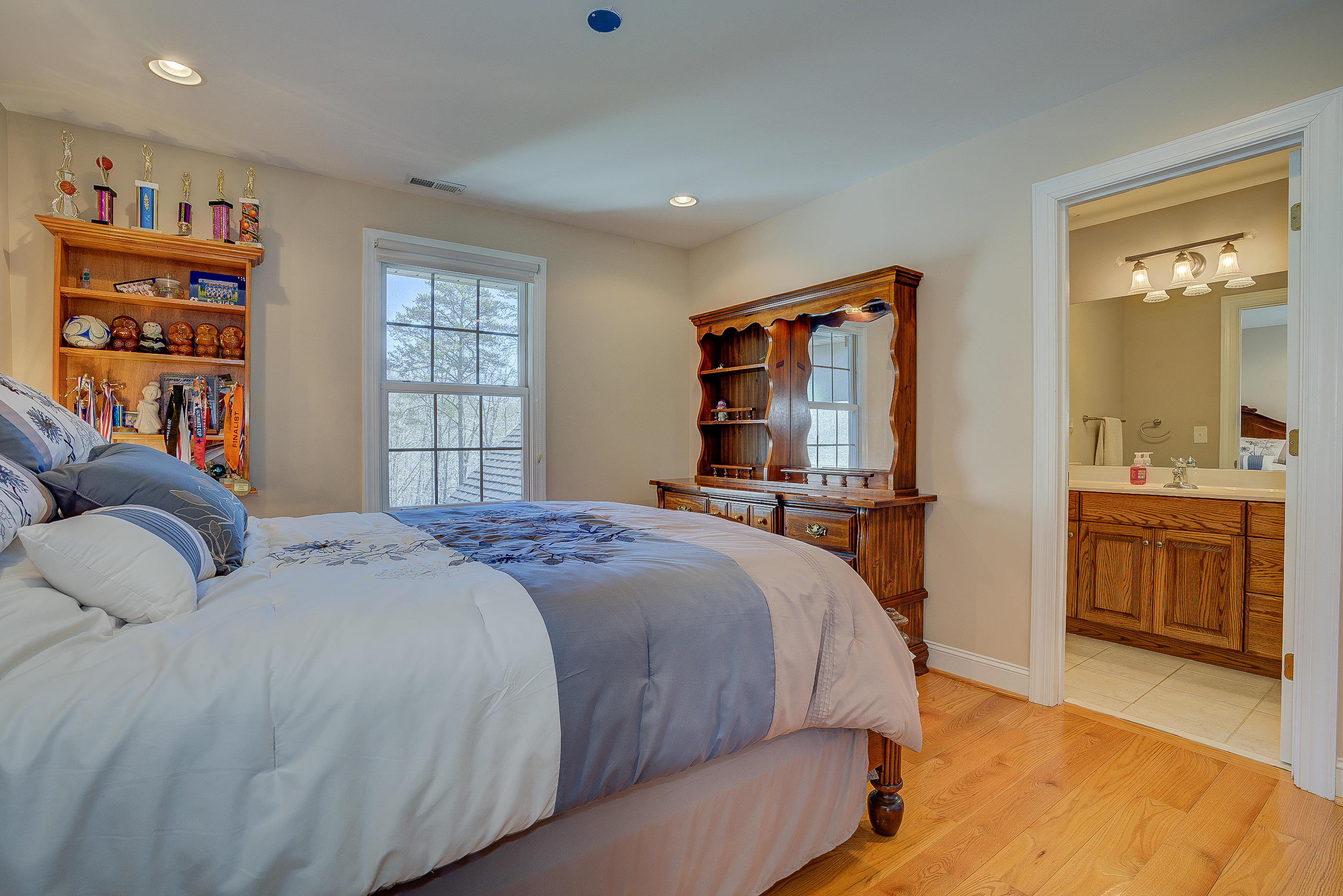 2851 New Ridge Road Elliston, VA 24087 - Photo 36 of 58 a bedroom with a large bed and a dresser