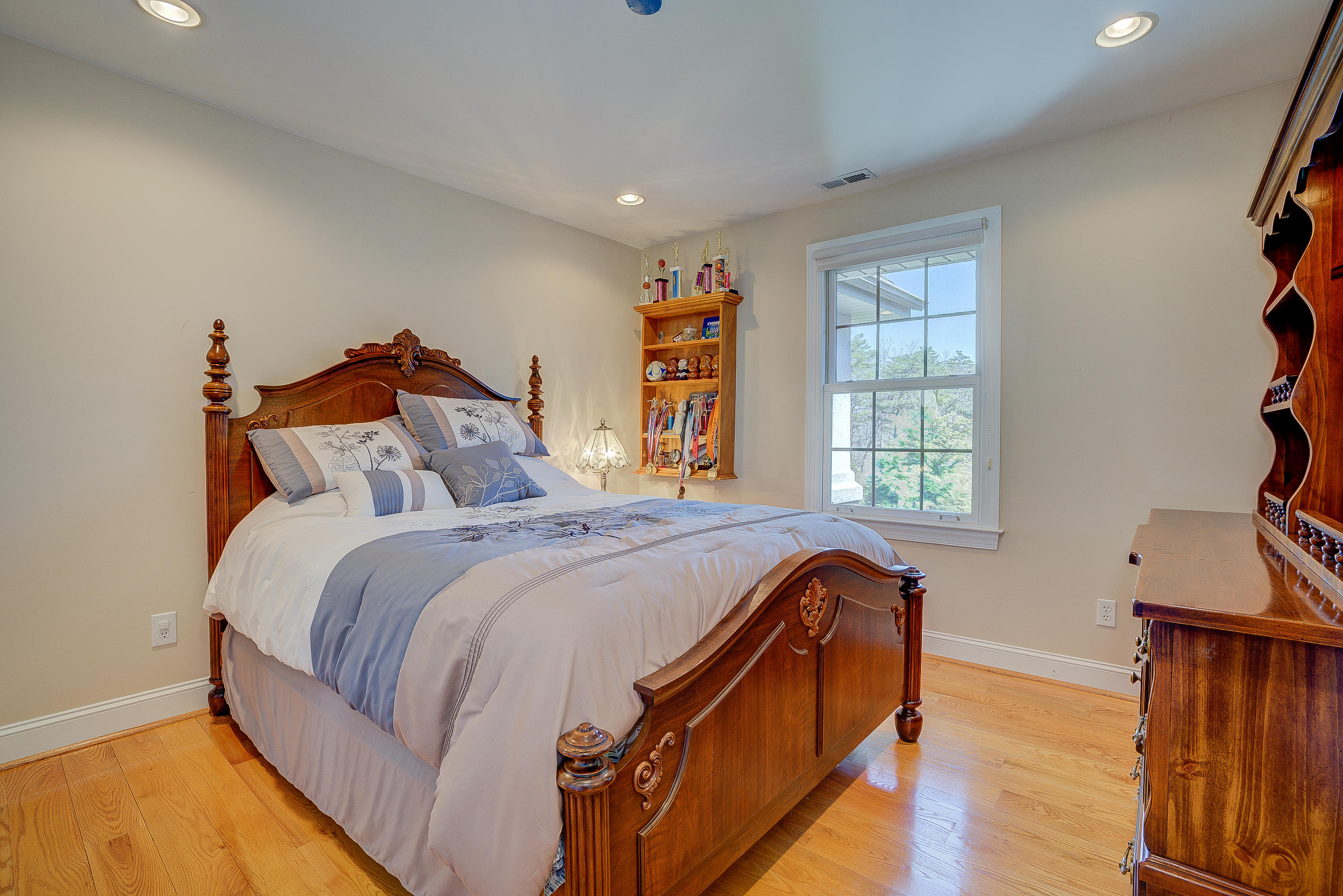 2851 New Ridge Road Elliston, VA 24087 - Photo 38 of 58 a bed sitting in a bedroom next to a window