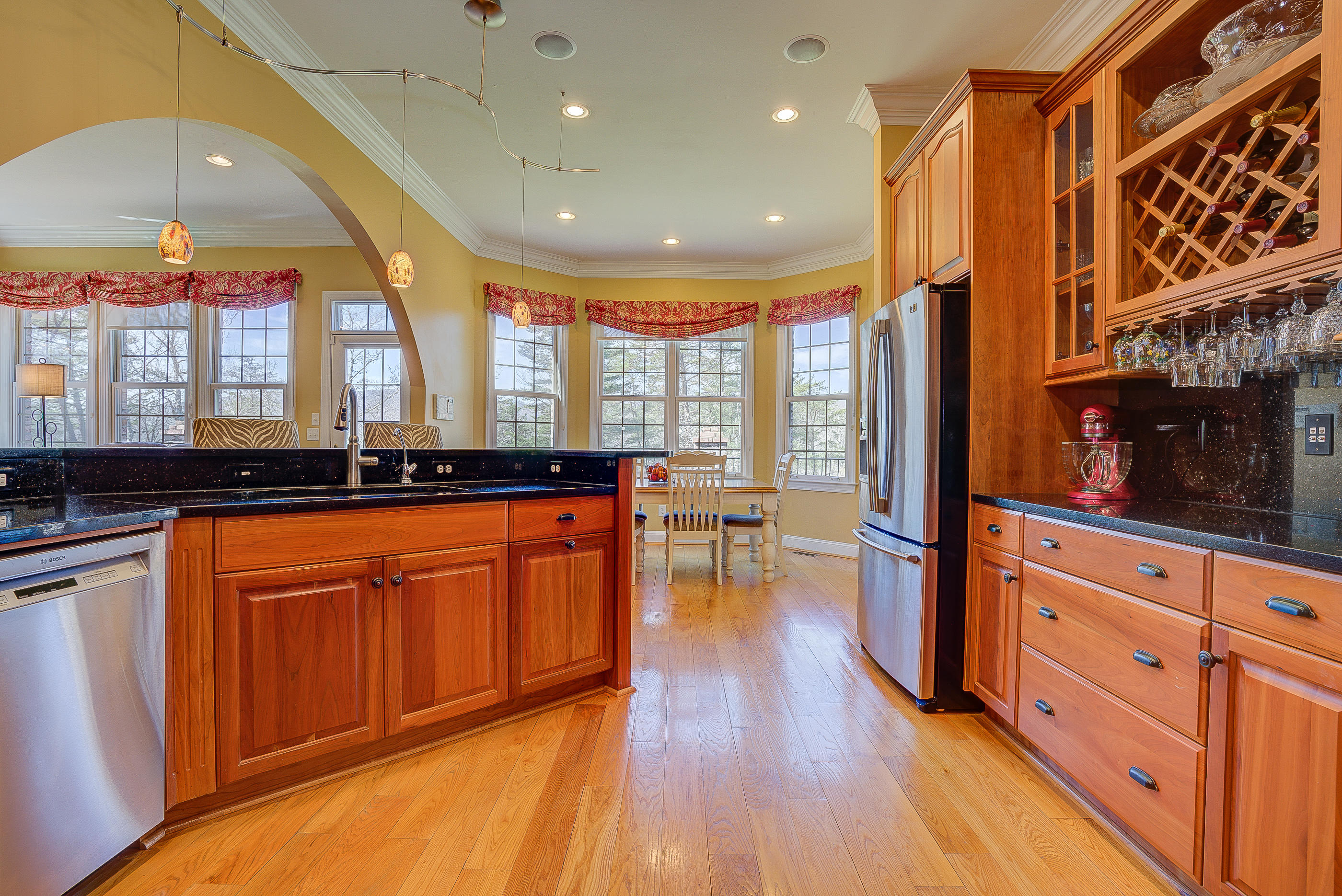 2851 New Ridge Road Elliston, VA 24087 - Photo 5 of 58 a large kitchen with stainless steel appliances granite countertop wooden floors a stove and a granite counter tops with a large window
