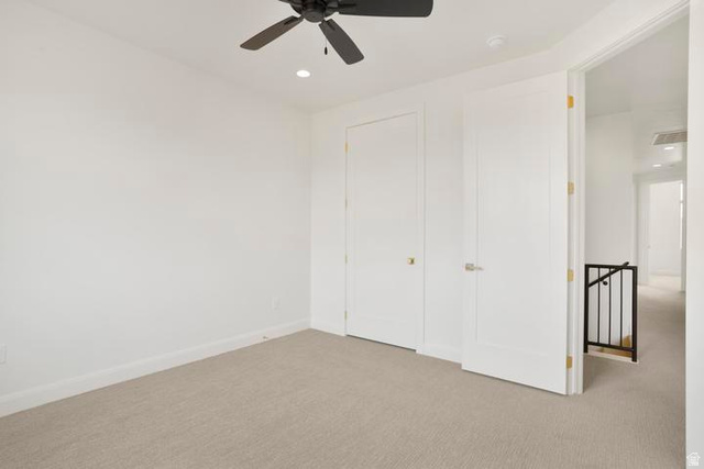 990 Manen Street Washington, UT 84780 - Photo 26 of 43 Neutral-toned carpeting paired with crisp white walls