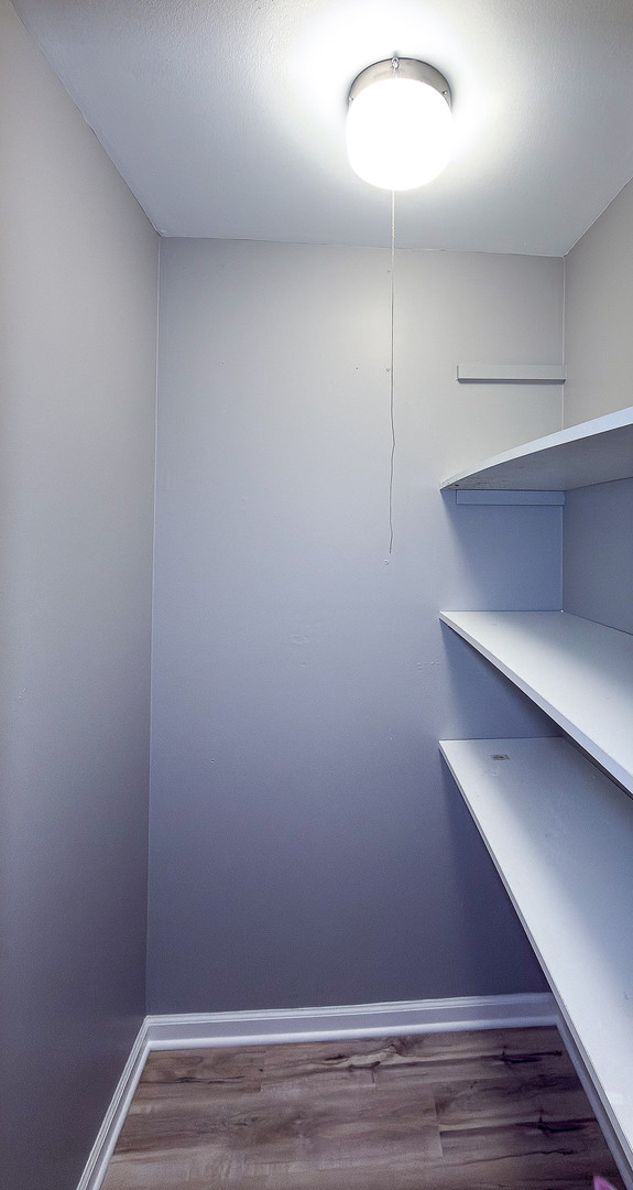 1703 Hedge Road Champaign, IL 61821 - Photo 14 of 17 a view of small space with racks on the wall