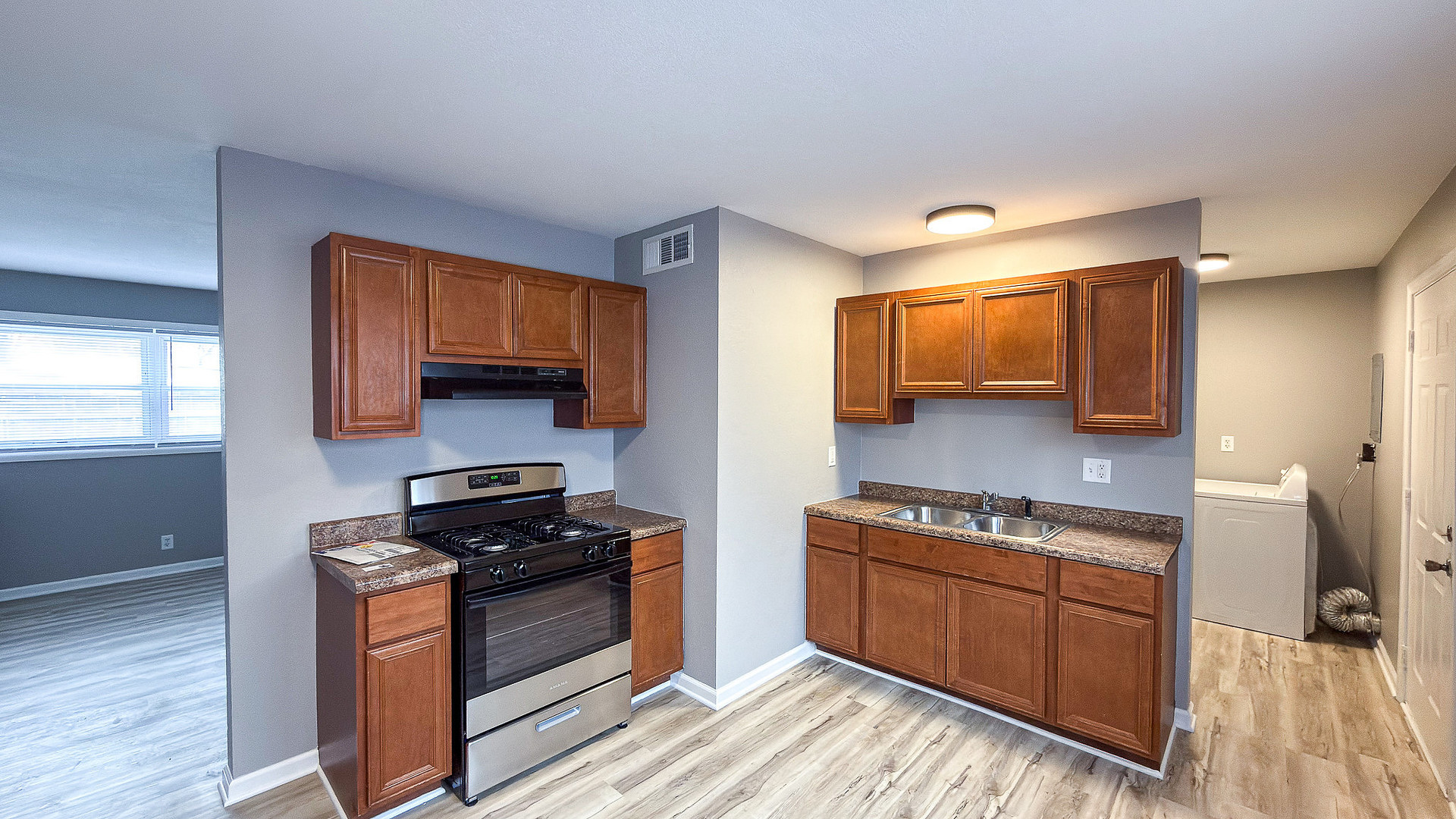 1703 Hedge Road Champaign, IL 61821 - Photo 5 of 17 a kitchen with stainless steel appliances granite countertop a stove and a sink