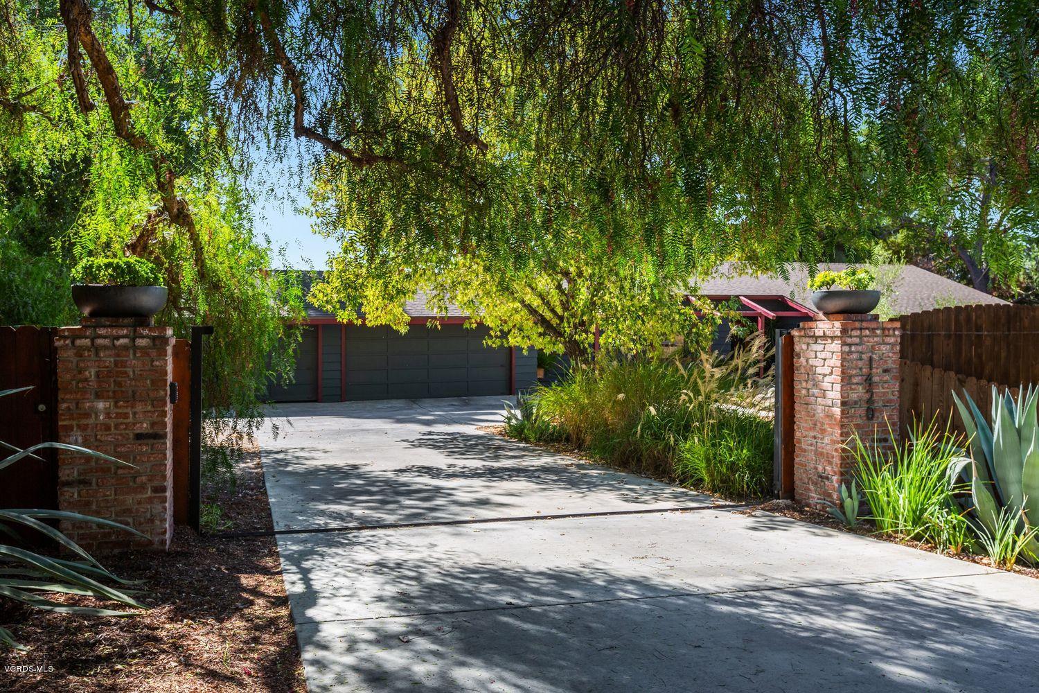 a backyard of a house with lots of green space