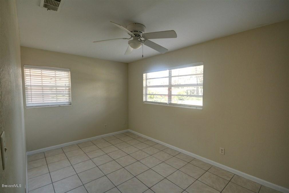 1312 Moss Lane Cocoa, FL 32922 - Photo 13 of 24 a view of an empty room with a window