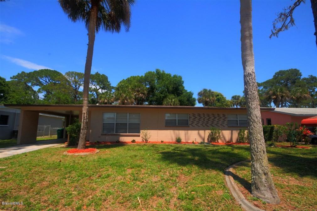 1312 Moss Lane Cocoa, FL 32922 - Photo 2 of 24 a view of swimming pool with a yard and potted plants