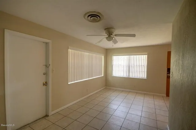 a view of an empty room and window