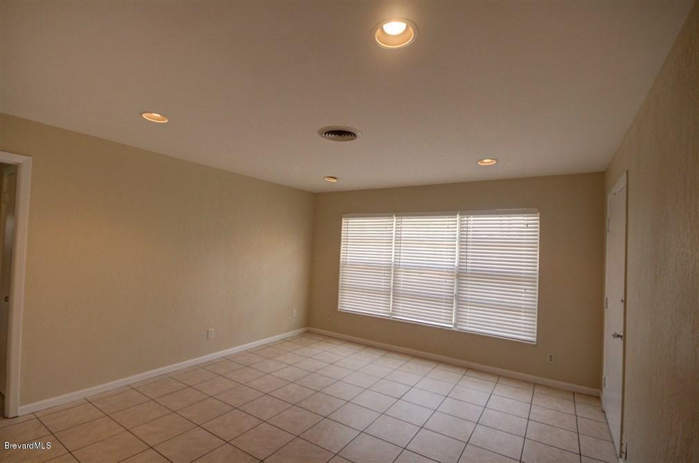 1312 Moss Lane Cocoa, FL 32922 - Photo 5 of 24 a view of an empty room with a window